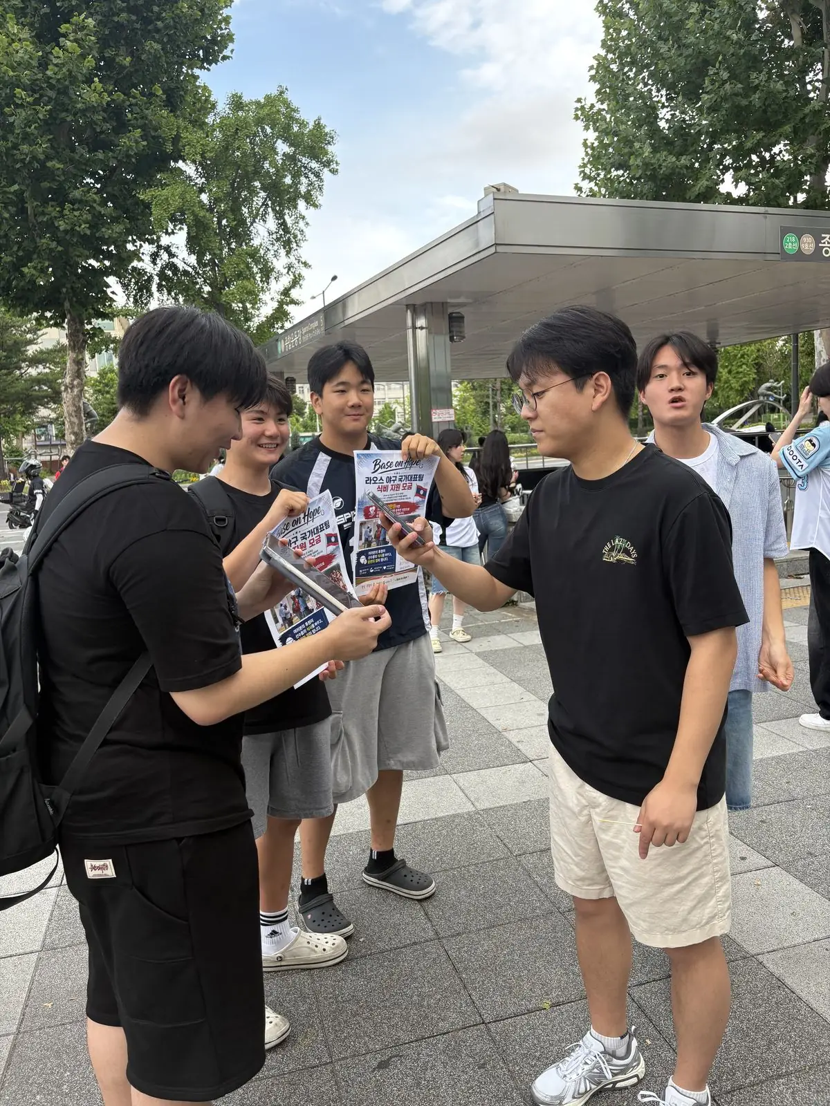 Talking with fans at Sports Complex station